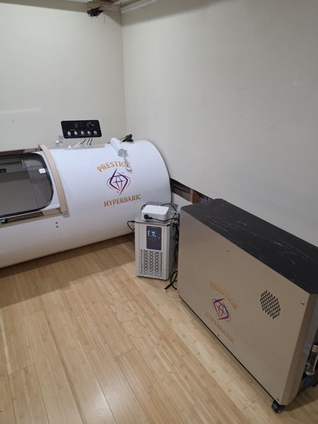 The full room: chamber, system cabinet, and AC unit — Grand Vessel of Power customer install in New York