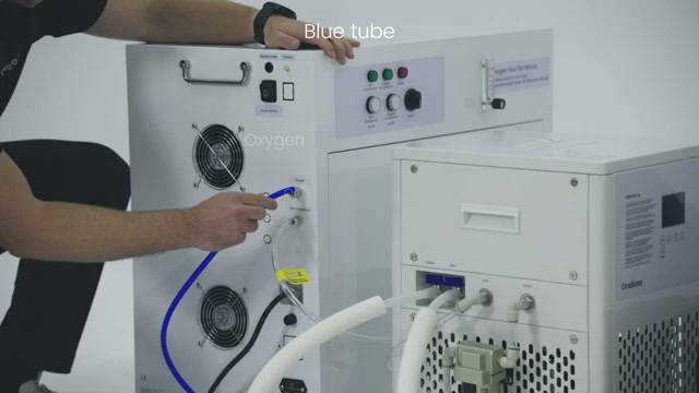 Technician reviewing chamber connections during installation