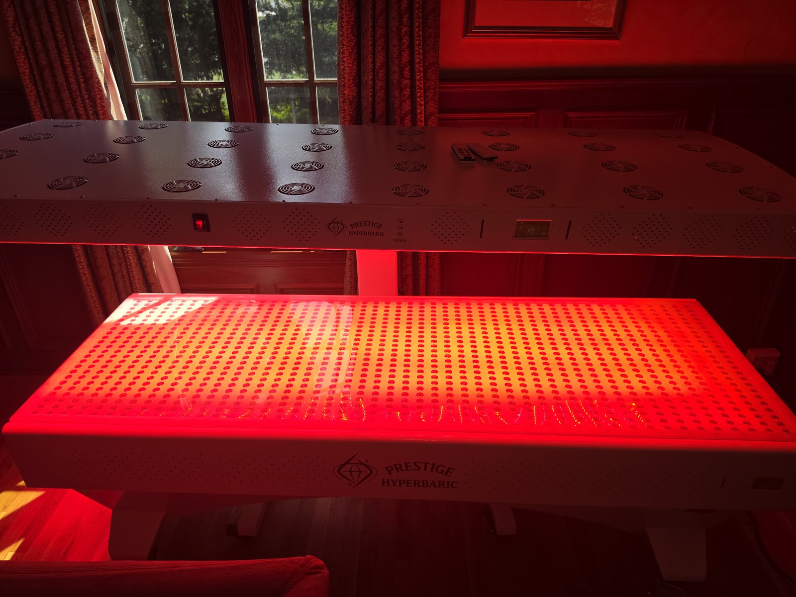 Prestige Pro modular red light therapy bed in a private wellness room