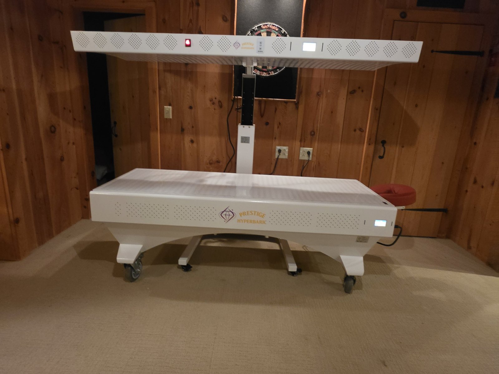 Prestige technician finishing the red light bed setup
