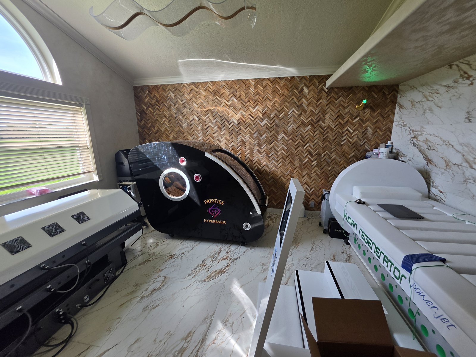 Grand Sphere of Power hyperbaric chamber installed in a customer home wellness room — hardshell sitting