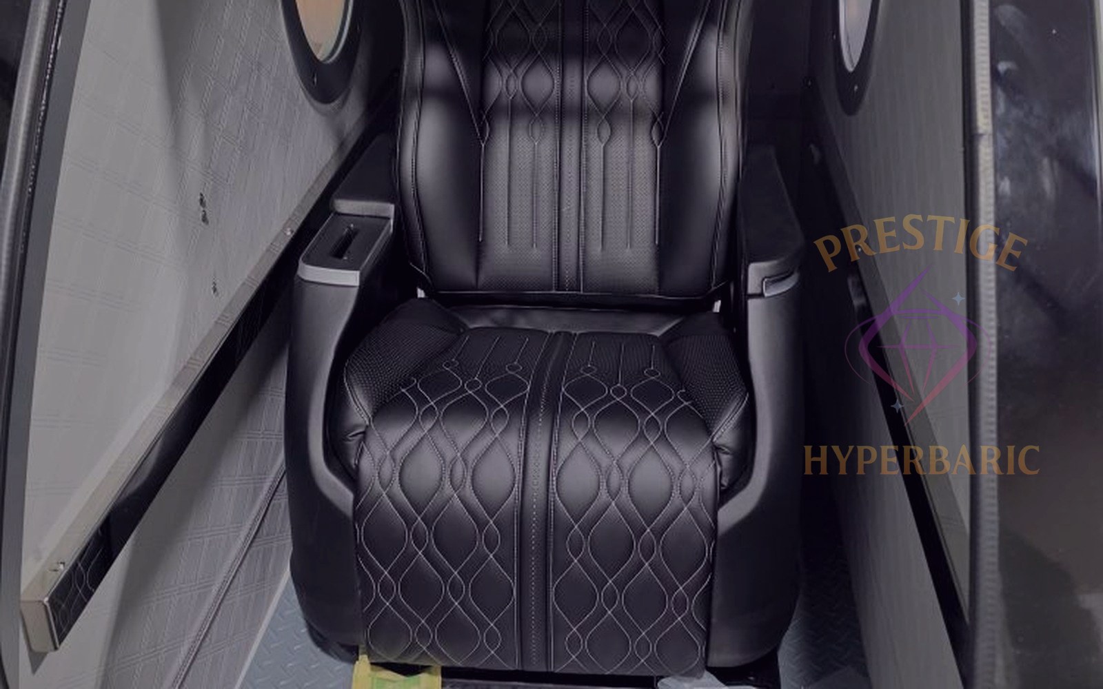 Interior of a Prestige Grand Sphere of Power hardshell chamber with quilted leather seat